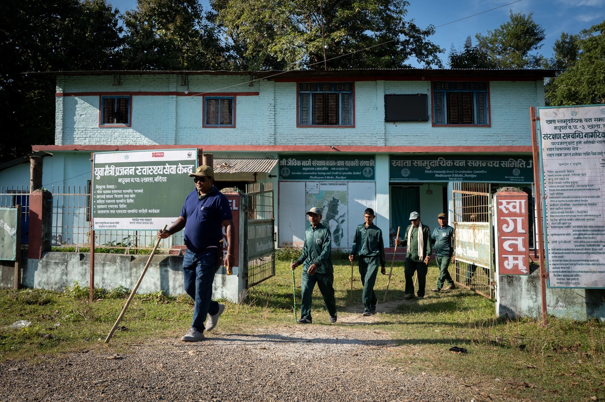 A group of people setting out from a building